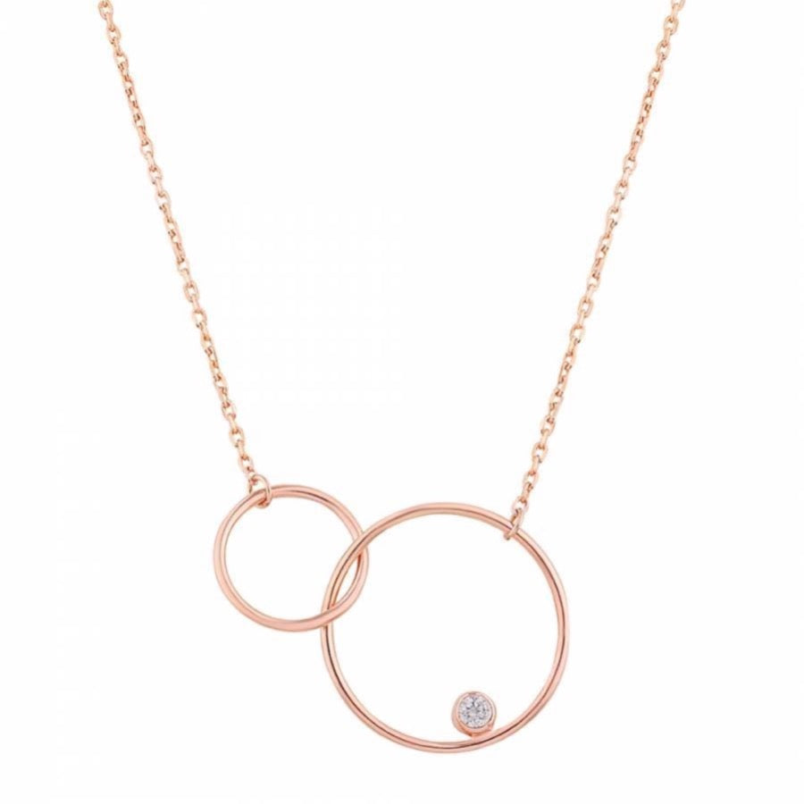 Rose gold plated necklace which two interpenetrated circles attached to silver chain. One of the circles is bigger than the other and has a little zircon stone in it.