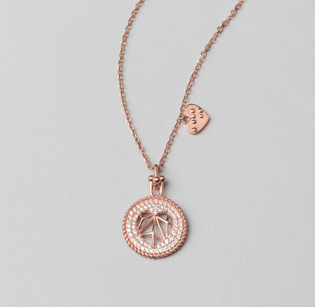 925 sterling silver, rose gold plated necklace with heart shaped pendant decorated with white zirconia stones.