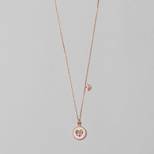 Photo of 925 sterling silver, rose gold plated necklace with white heart shape pendant, complete look.