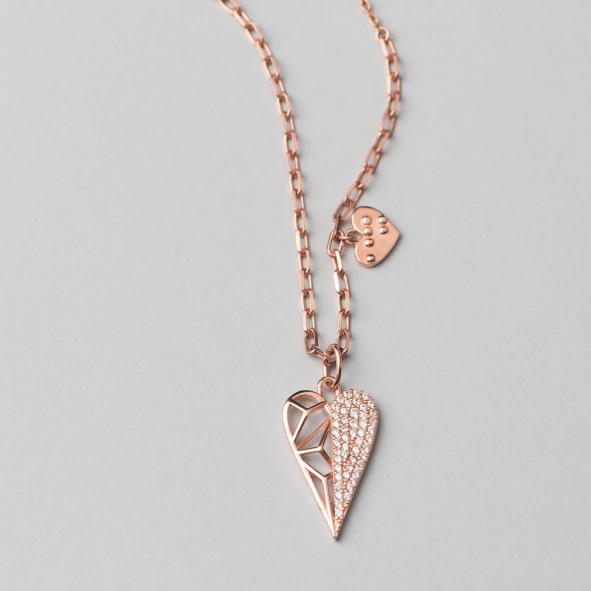 Rose gold plated, 925 sterling silver  necklace with heart pendant. Half of the pendant is decorated with white zirconia stones.