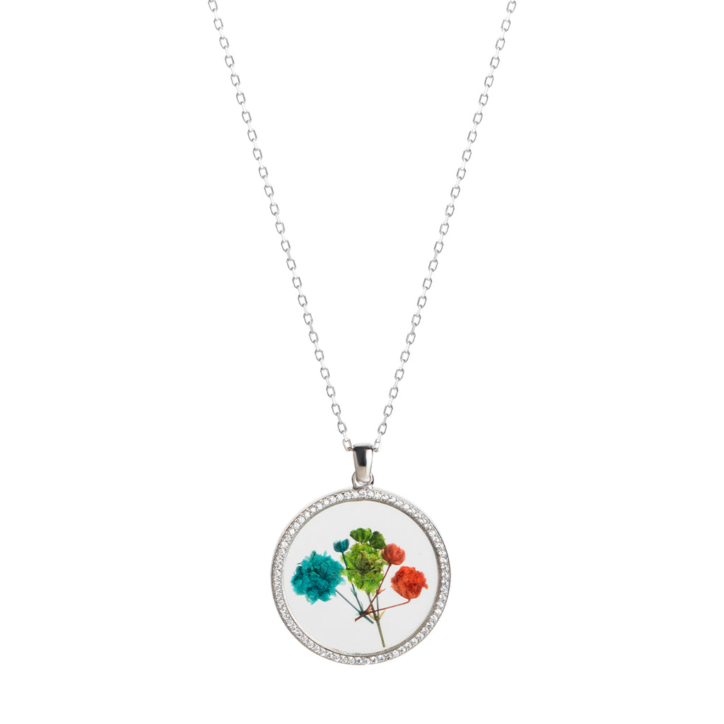 925 Sterling silver necklace with circle  glass pendant with dried flowers in it.