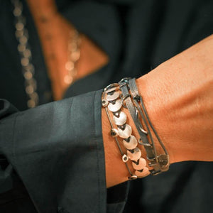 Custom design, silver, hand made bracelet with herringbone pattern silver beads on wrist.