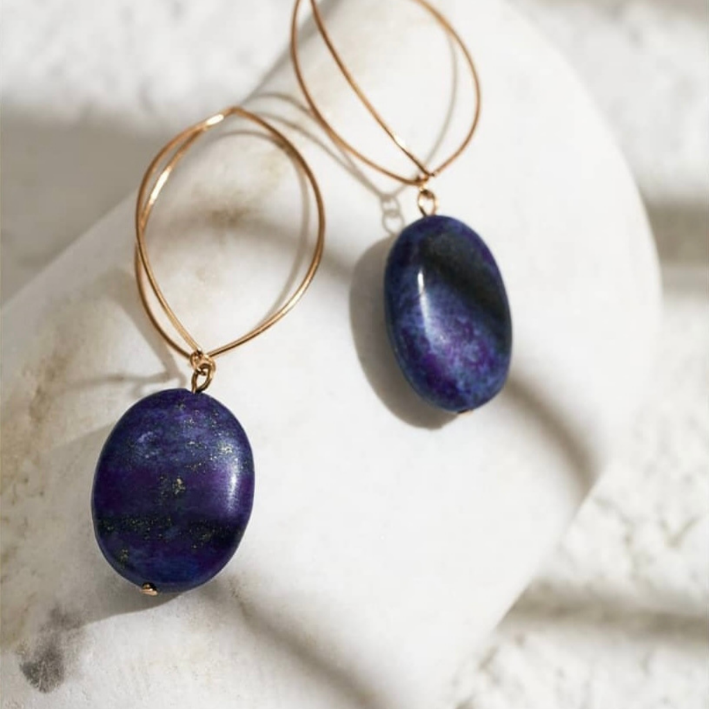 Navy blue natural stone earrings photo on a white stone.