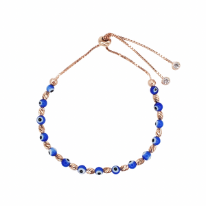 Rose gold bracelet with blue evil eye beads.