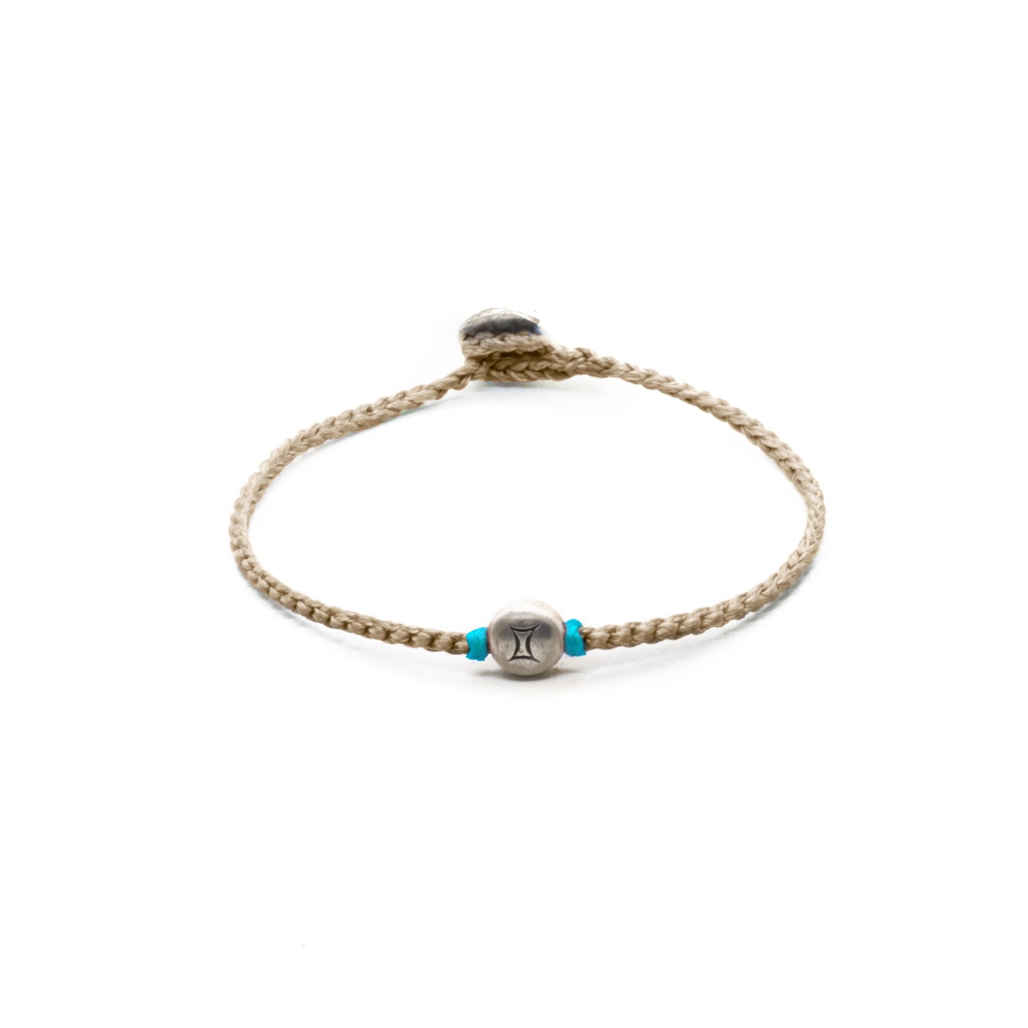Silver Gemini zodiac sign bracelet with beige hand braided chain.