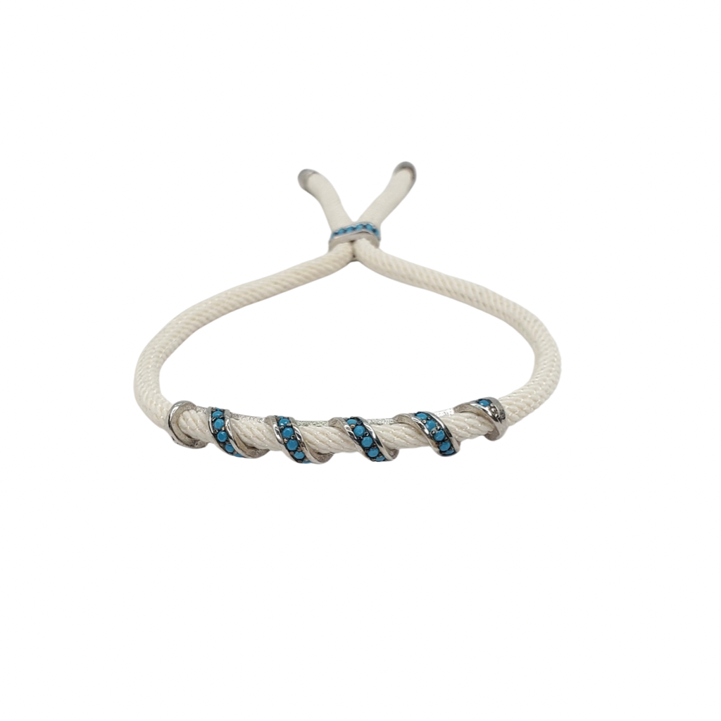 Turquoise zirconia, silver bracelet on a beige cord, front look.