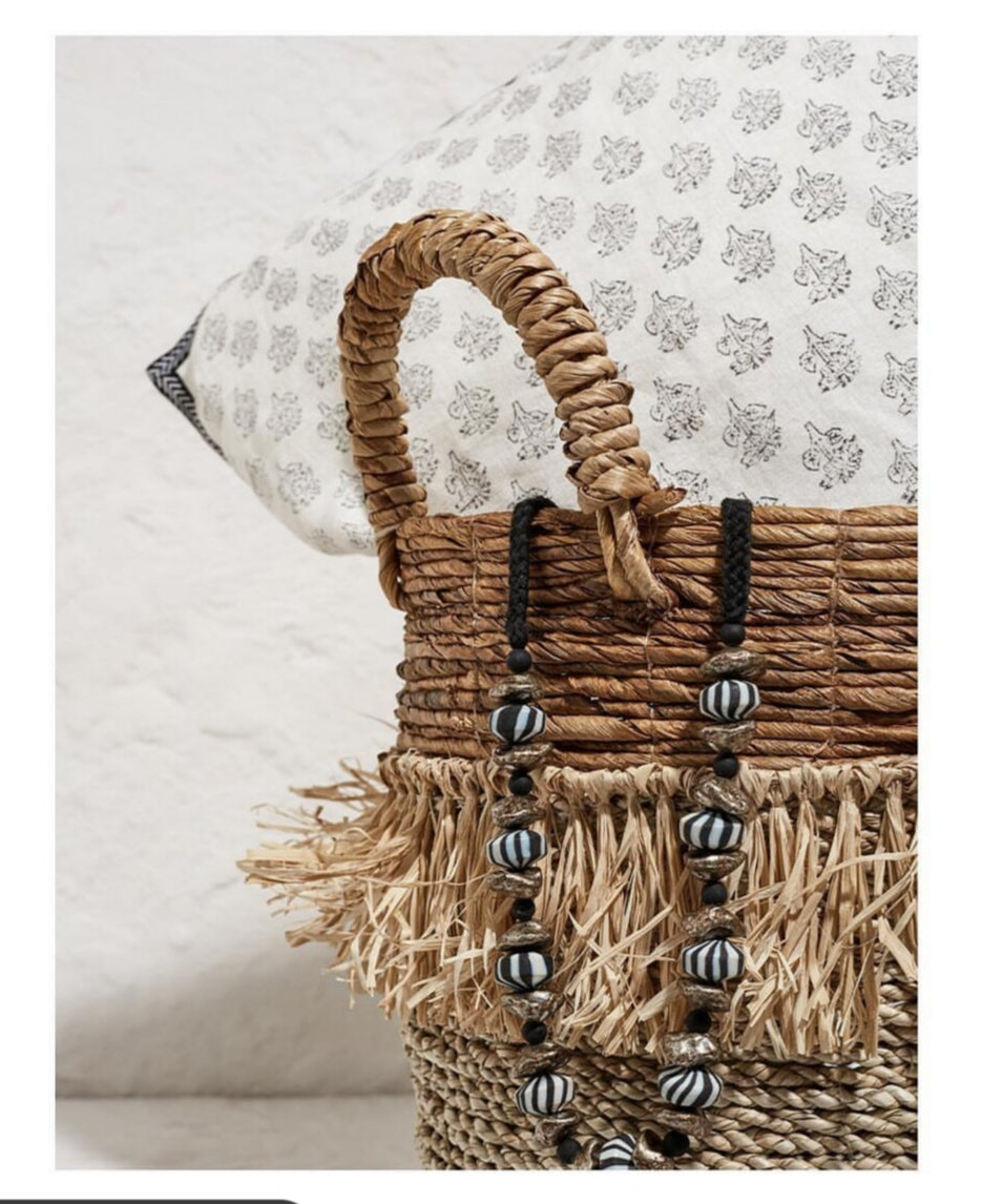 Zebra Striped Necklace on A Decorative Basket