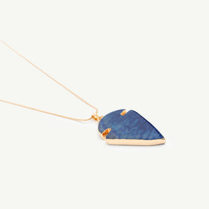 Arrow shaped blue necklace with golden chain.