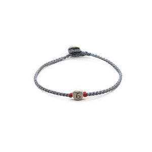 Silver Capricorn zodiac sign bracelet with grey hand braided chain.