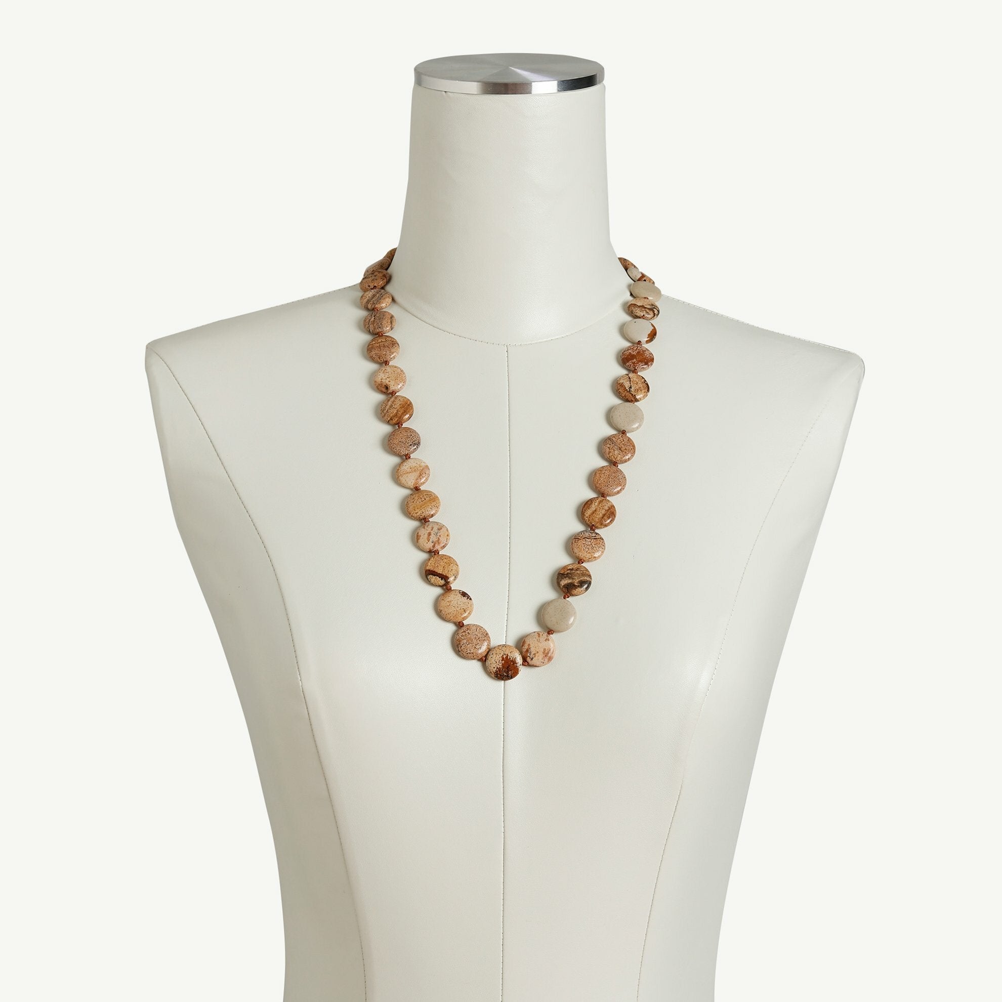 Jasper stone necklace on a dressmaker.