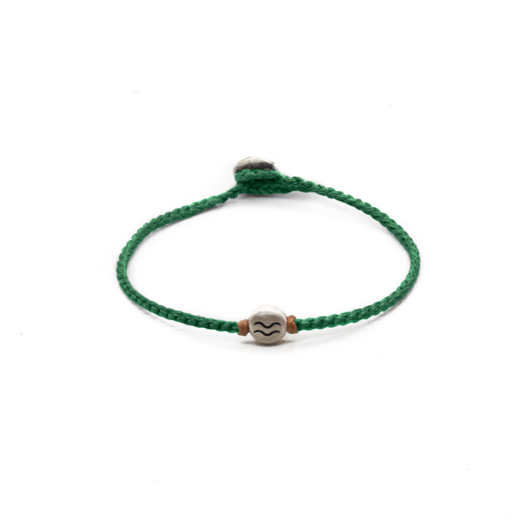 Aquarius zodiac sign emerald green bracelet with hand braided cord.