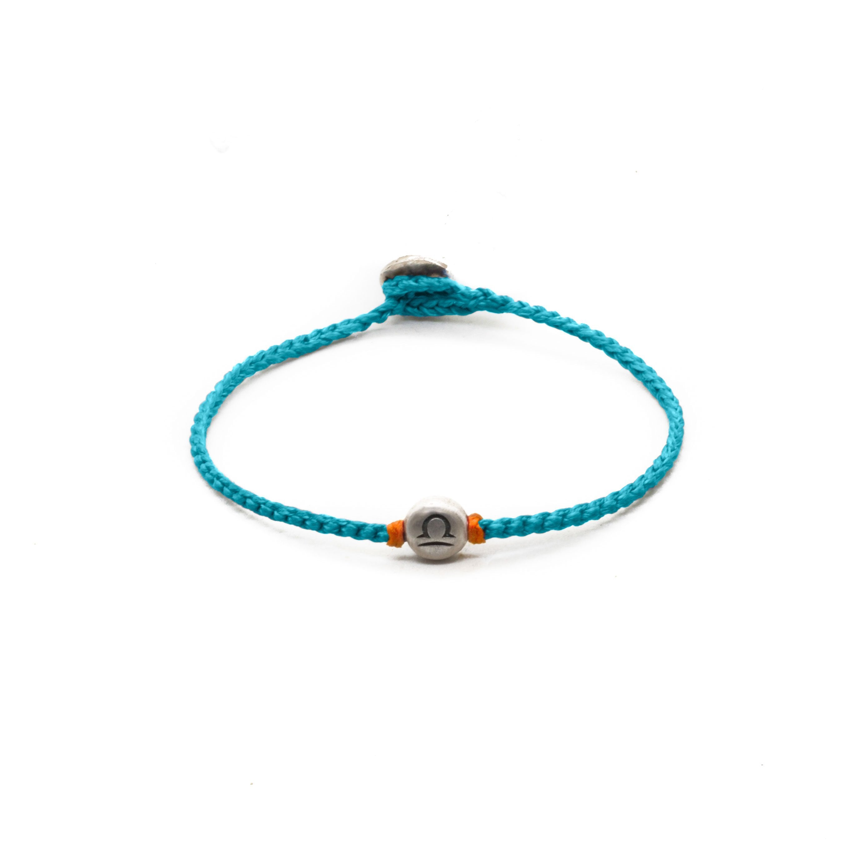 Silver Libra zodiac sign bracelet with turquoise  hand braided chain.