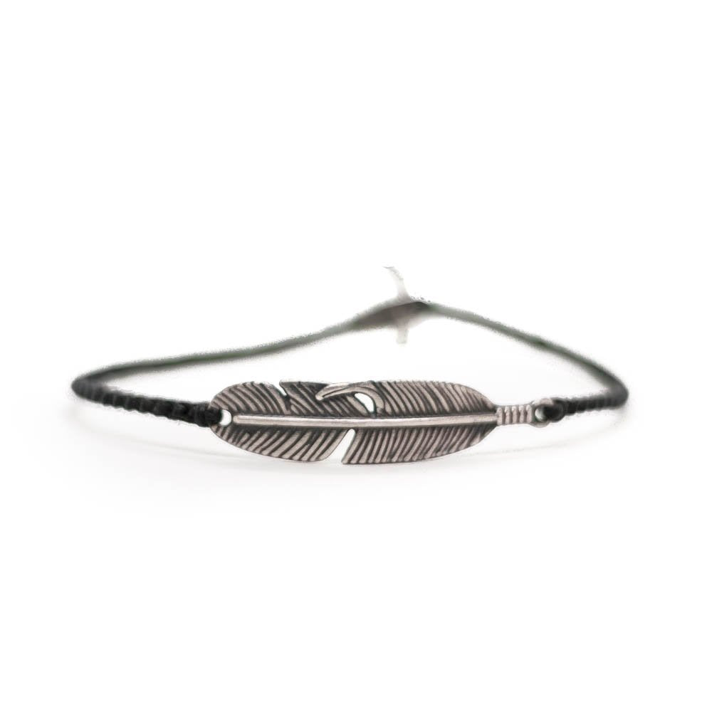 Silver leaf, black string bracelet ending with silver clasp.