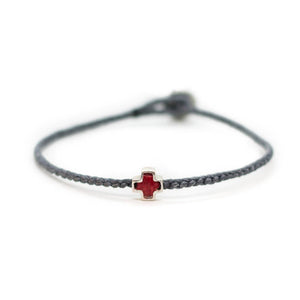 Fifth bracelet with braided string and silver cross symbol 